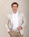 Slim fit jersey blazer in beige met visgraatstructuur 