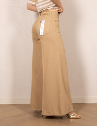 Flared jeans in beige