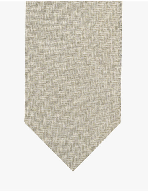 Das met visgraatstructuur in licht zand