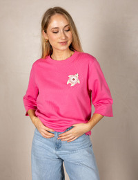 Roze pull met sierlijke schildpadapplicatie
