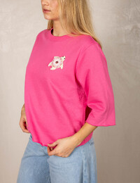 Roze pull met sierlijke schildpadapplicatie