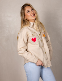 Blouse met kleurrijke applicaties en franjezoom