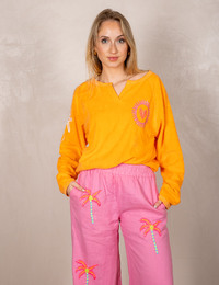 Oranje sweatshirt met Sundowner print