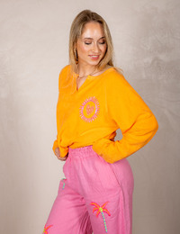 Oranje sweatshirt met Sundowner print
