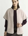 Coema - teddy cape met faux leather details