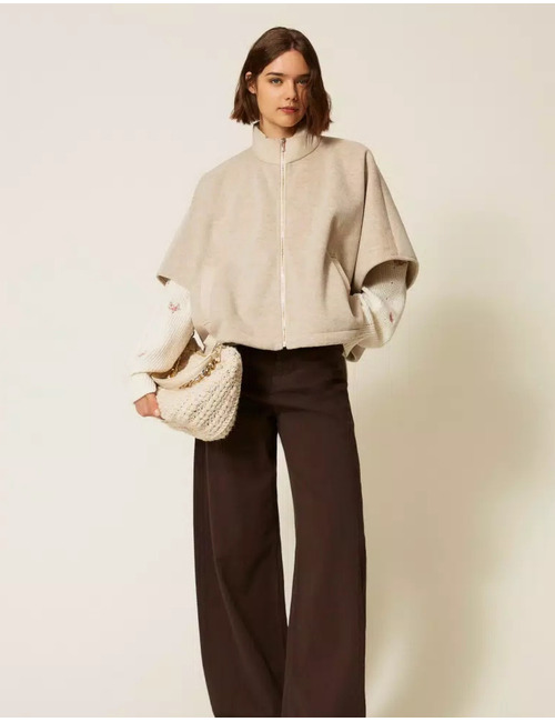 Poncho avec fermeture zippée et col montant
