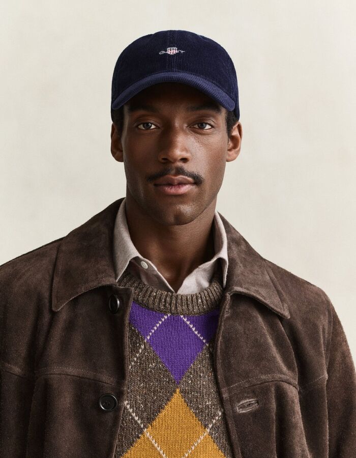 Corduroy pet met geborduurd schildlogo blauw